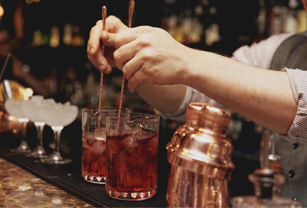 Hyatt Centric Janakpuri New Delhi Hotell Exteriör bild A bartender stirring a Negroni