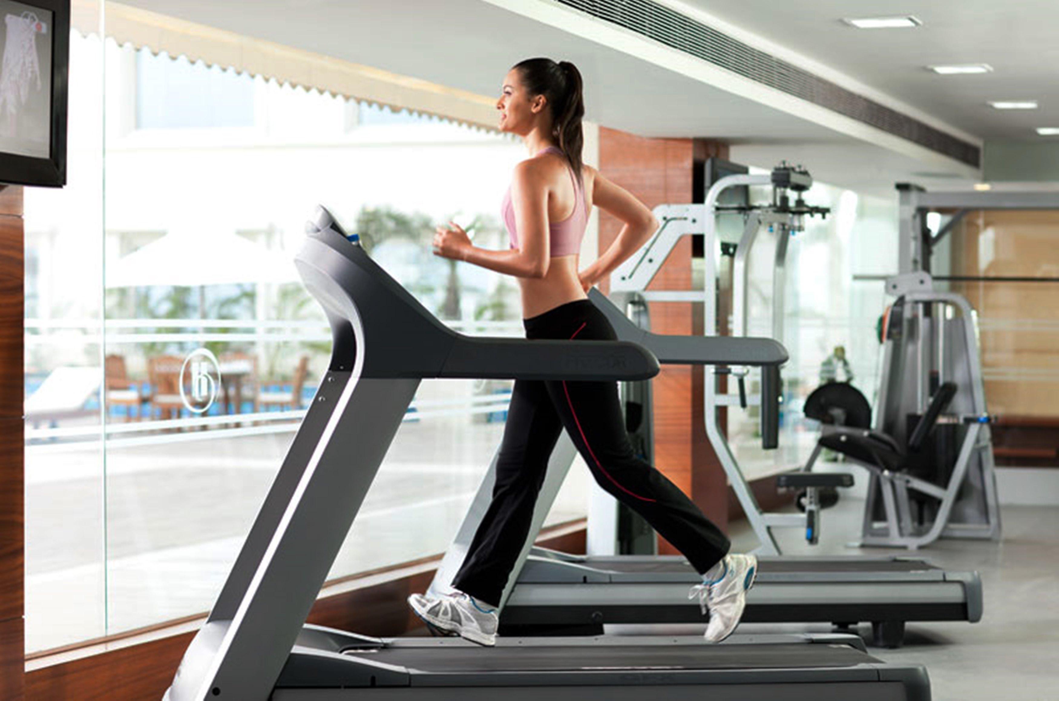 Hyatt Centric Janakpuri New Delhi Hotell Exteriör bild A woman exercising on a treadmill